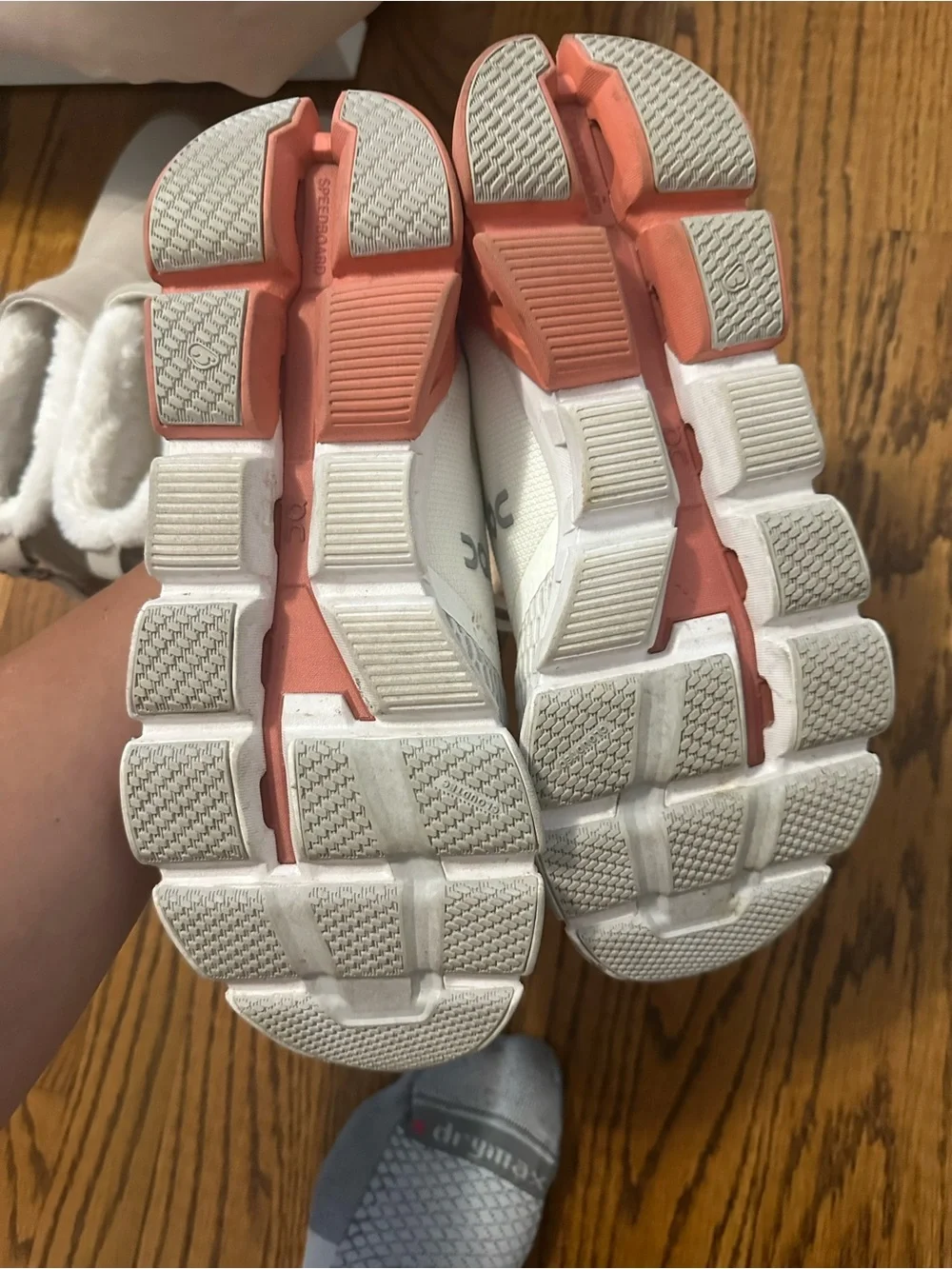 On Running Women’s White and Coral Lace-Up Sneakers
